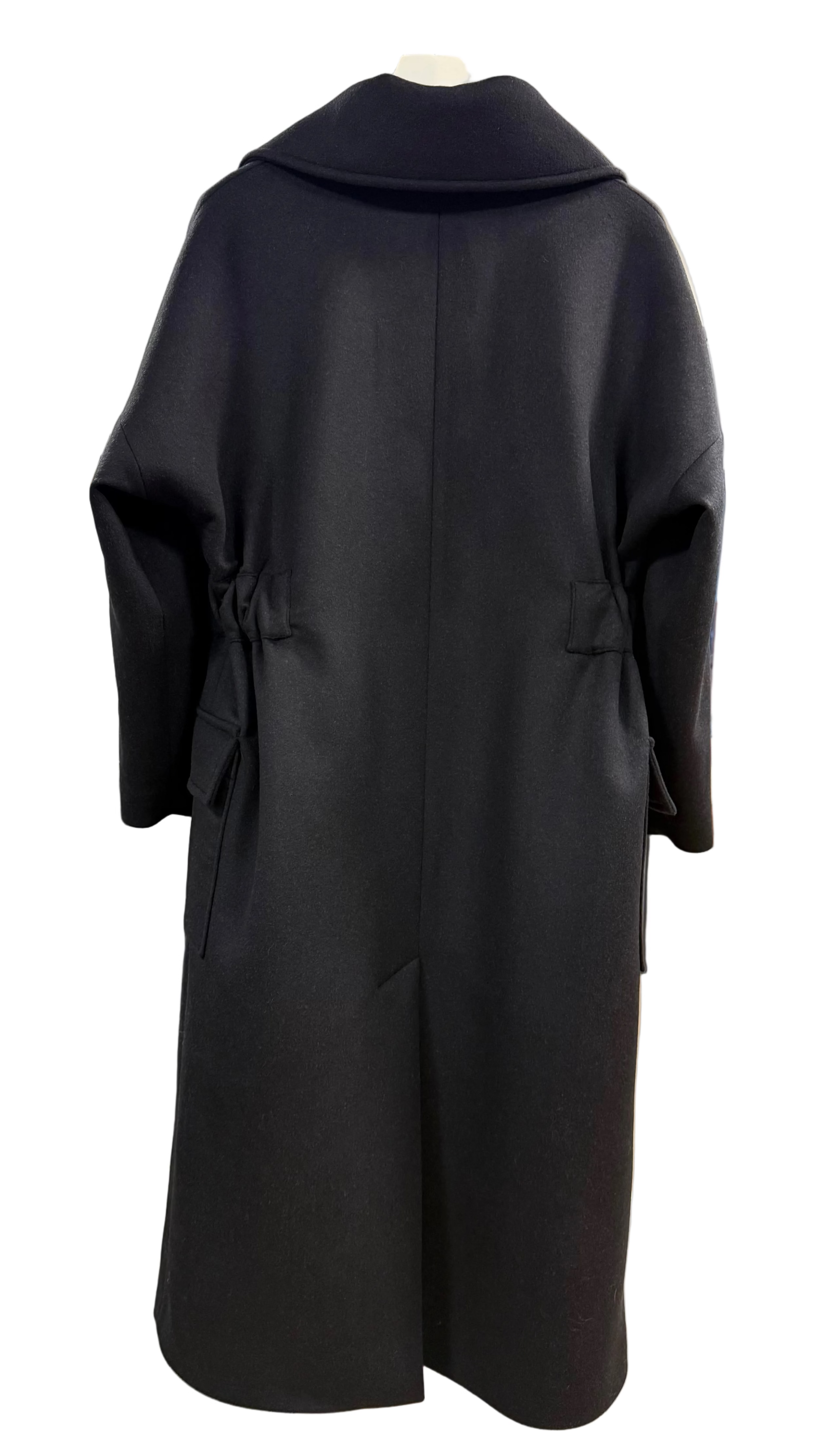 A black long coat displayed on a hanger, shown from the back. The coat has a wide collar, long sleeves, and a gathered waist detail.