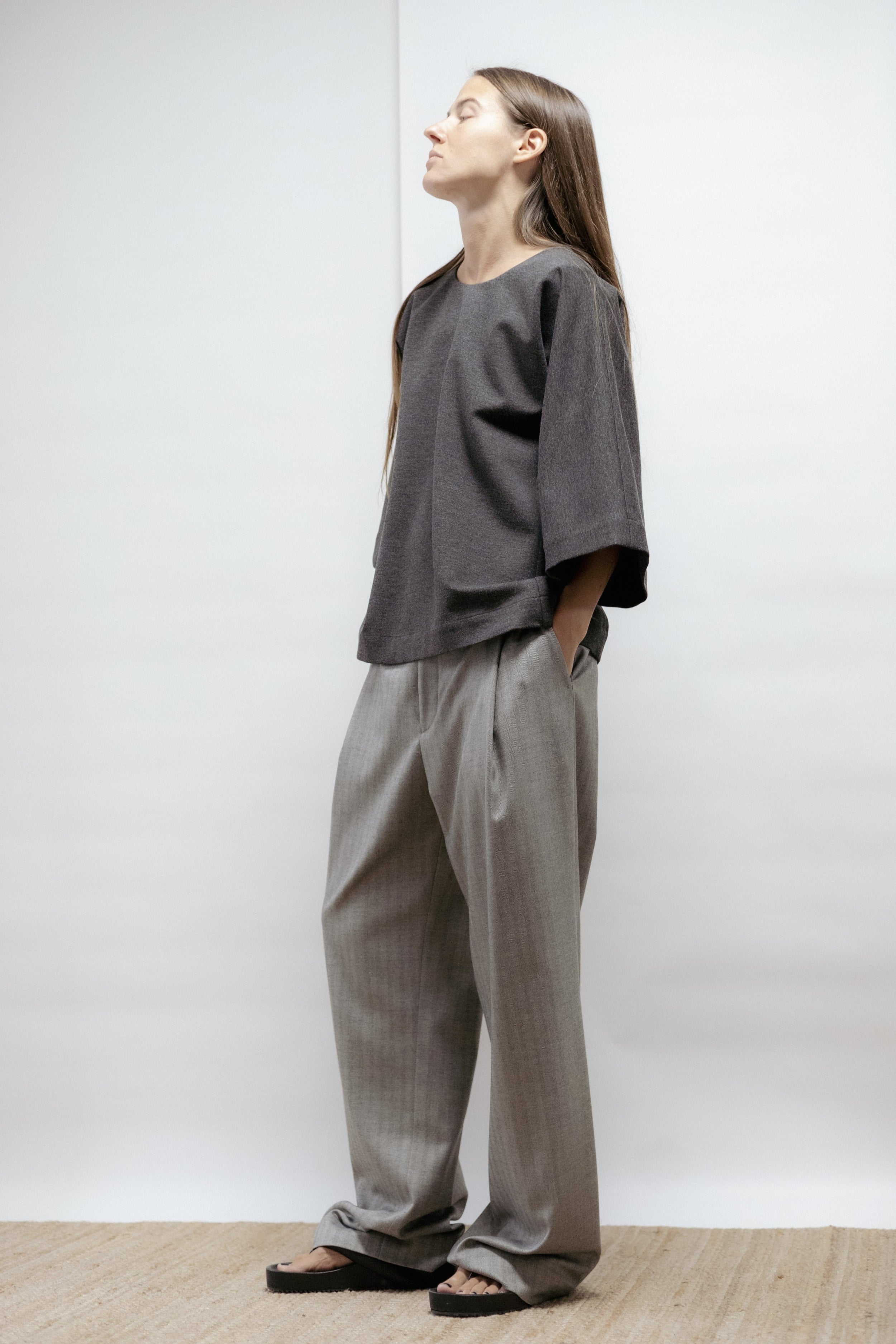 Dark grey jersey blouse with wide sleeves and relaxed cut. Minimalist and comfortable design made in Estonia. Elegant in its simplicity.