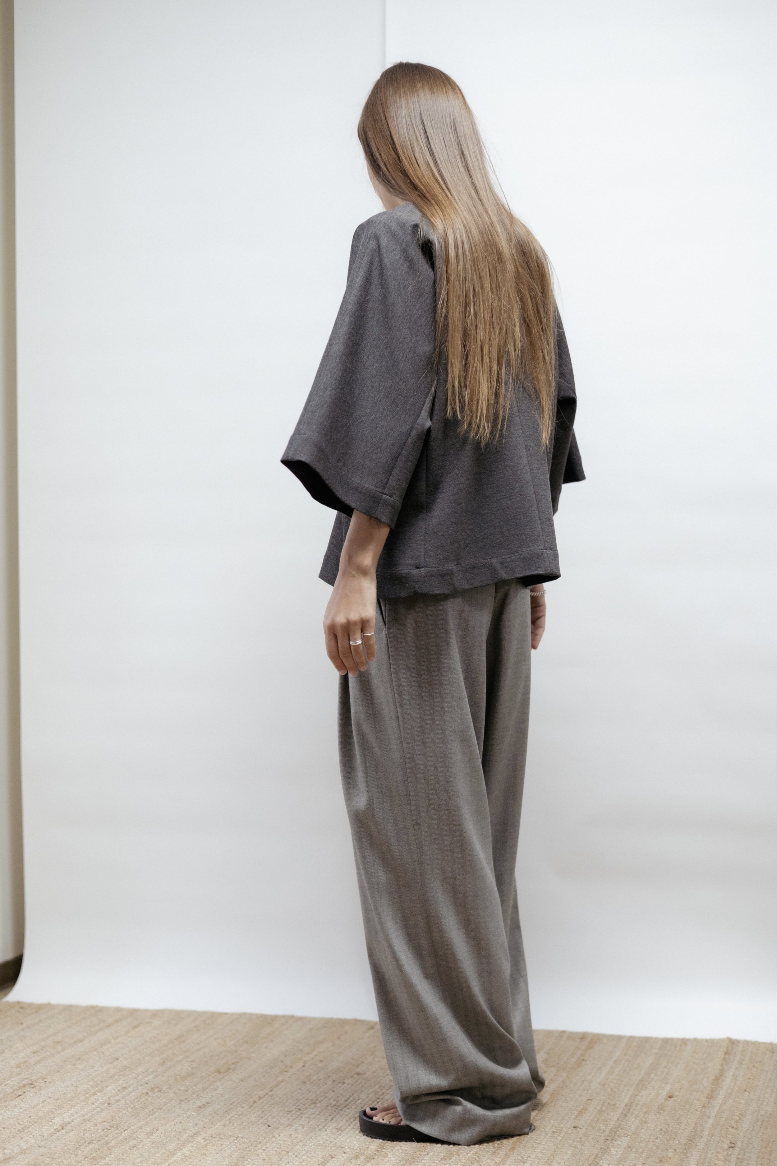 Dark grey jersey blouse with wide sleeves and round neckline. Relaxed fit and soft structure. Made in Estonia, timeless and versatile.