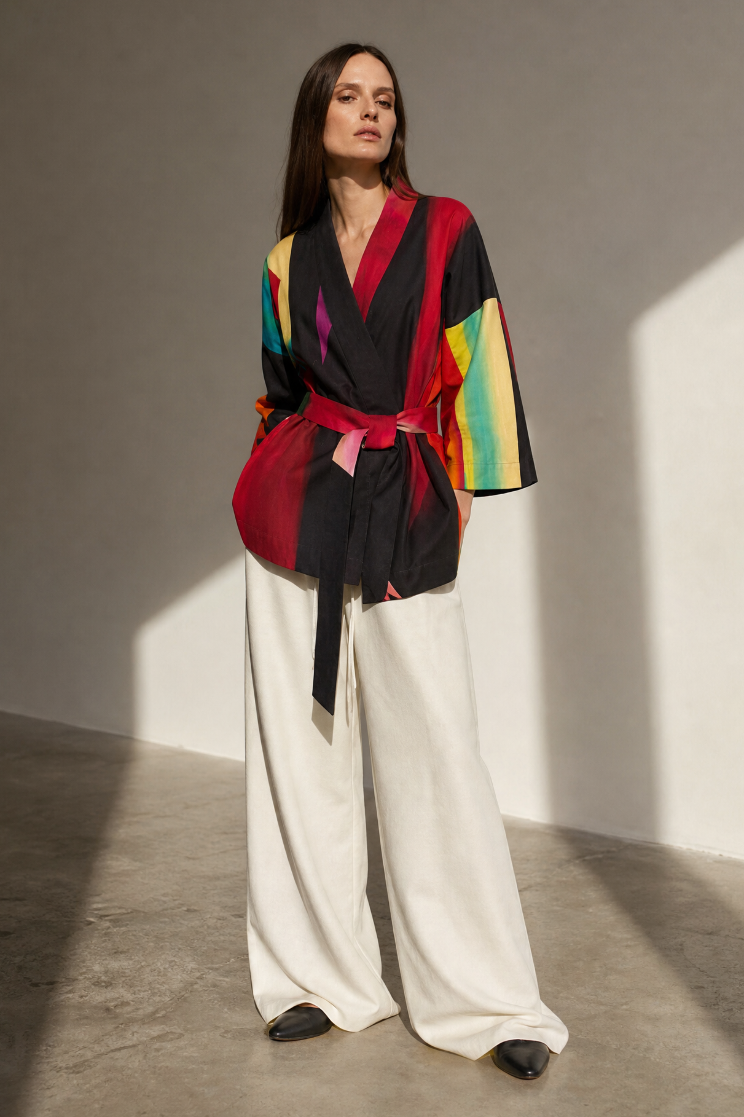 Woman wearing a colorful outfit with a black background