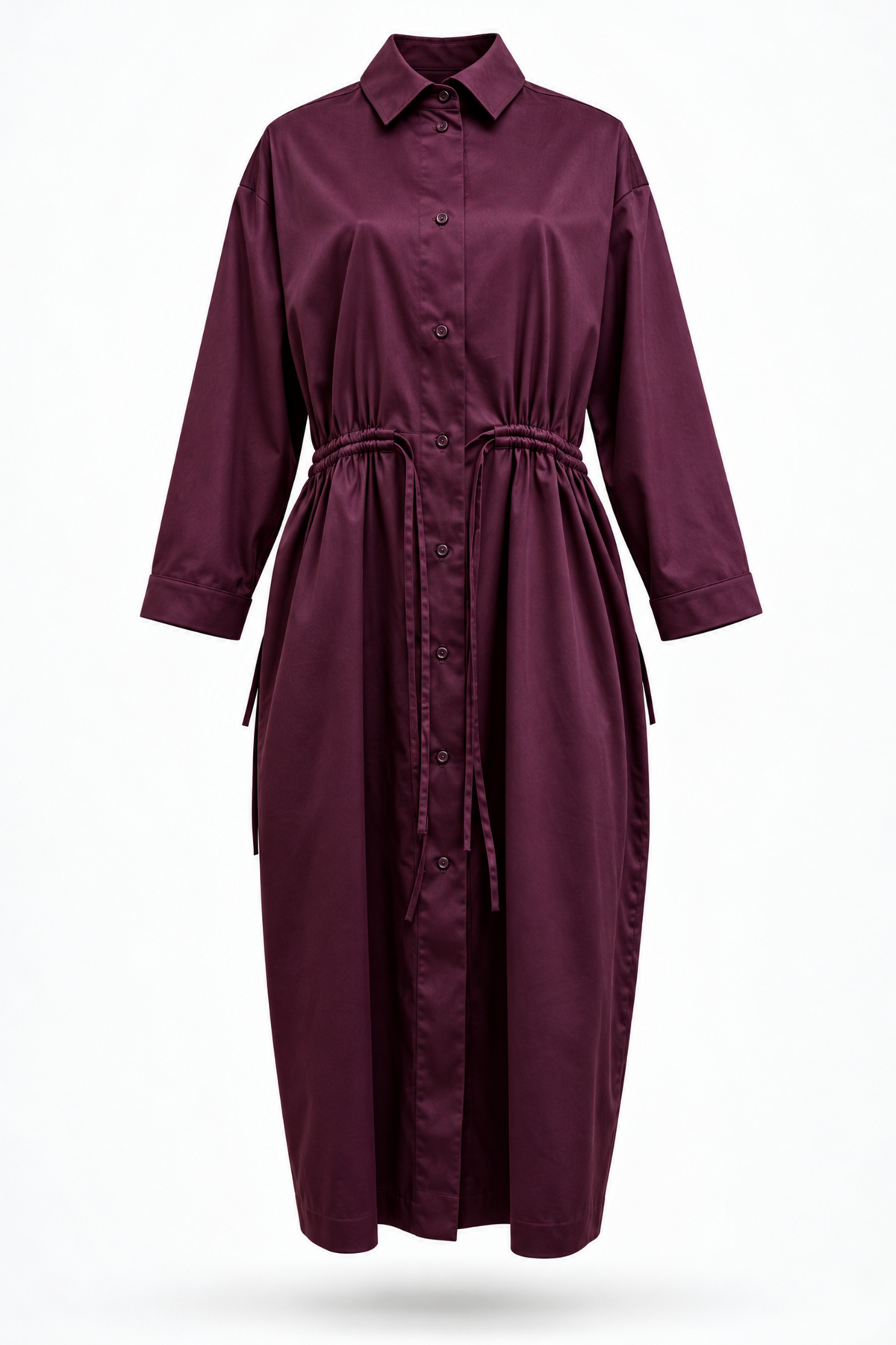 A long-sleeved button-front shirt dress in deep burgundy, featuring a pointed collar, a drawstring waist, and side pockets, shown against a plain white background.
