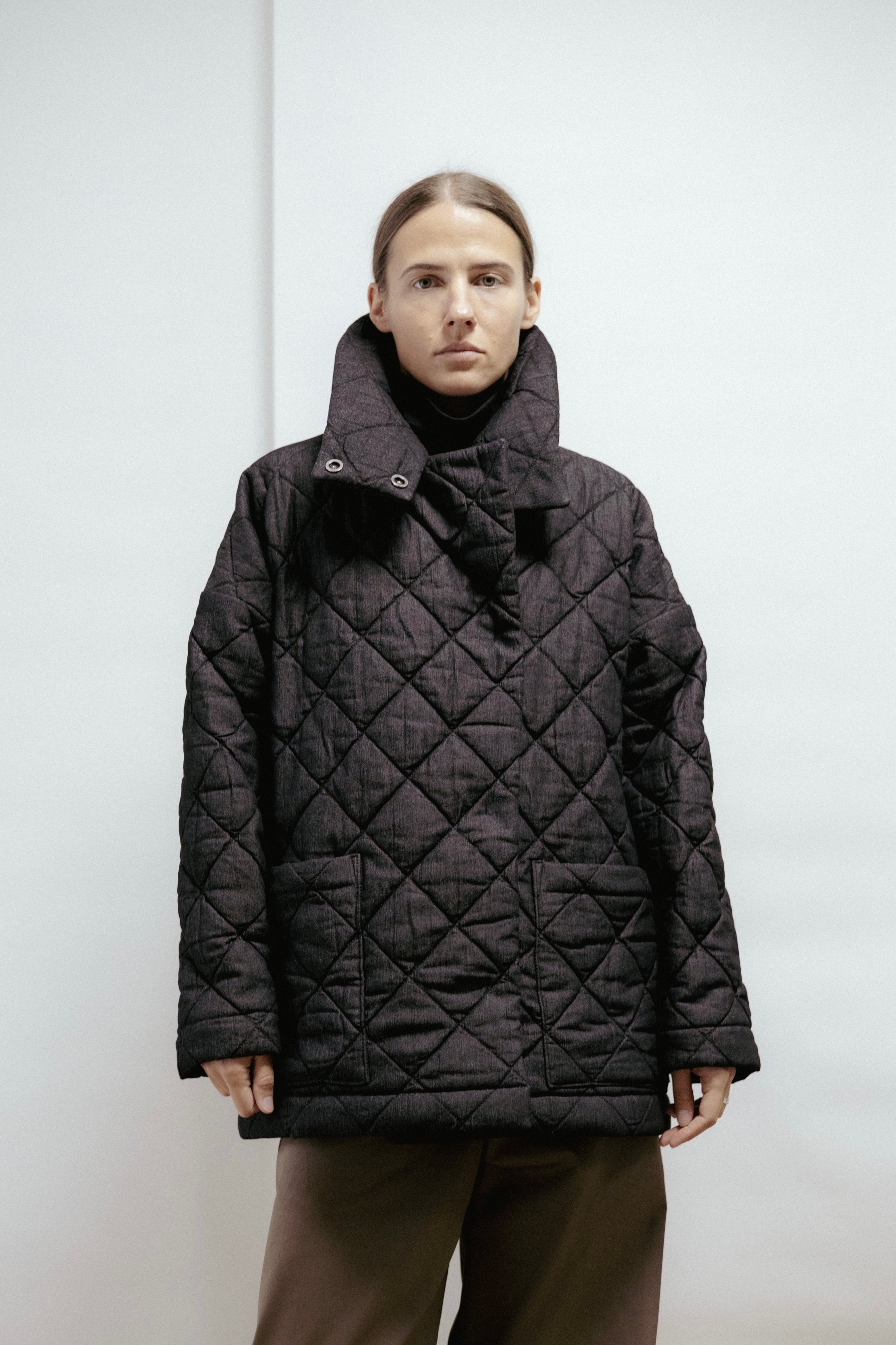 Warm quilted denim jacket with a relaxed fit and high collar. Timeless design for comfort and everyday wear. Made in Estonia.