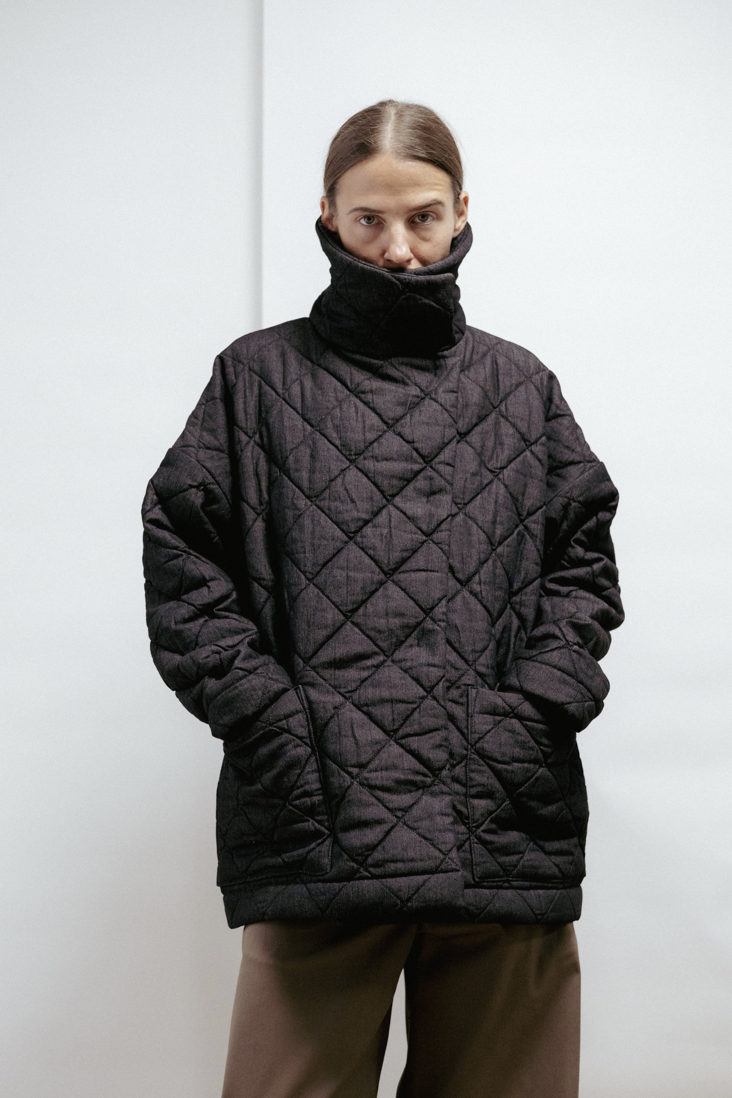 Quilted denim jacket with a straight, relaxed fit. Warmly padded with a high collar and large patch pockets. Made in Estonia.