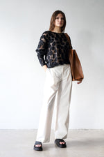 Ankle-length trousers in white