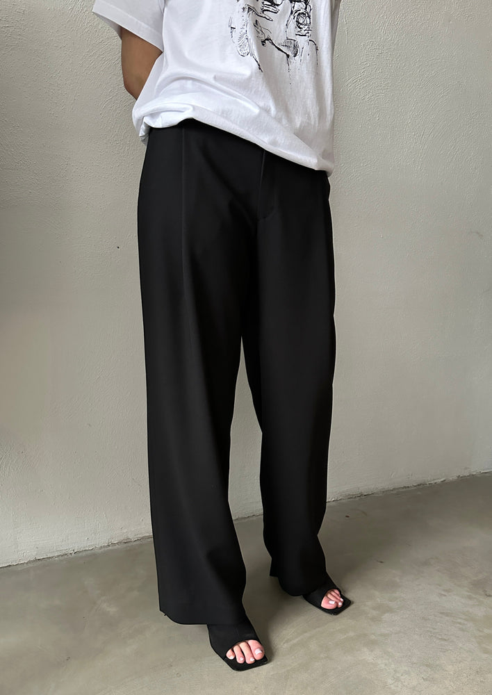 Wide trousers in black wool fabric