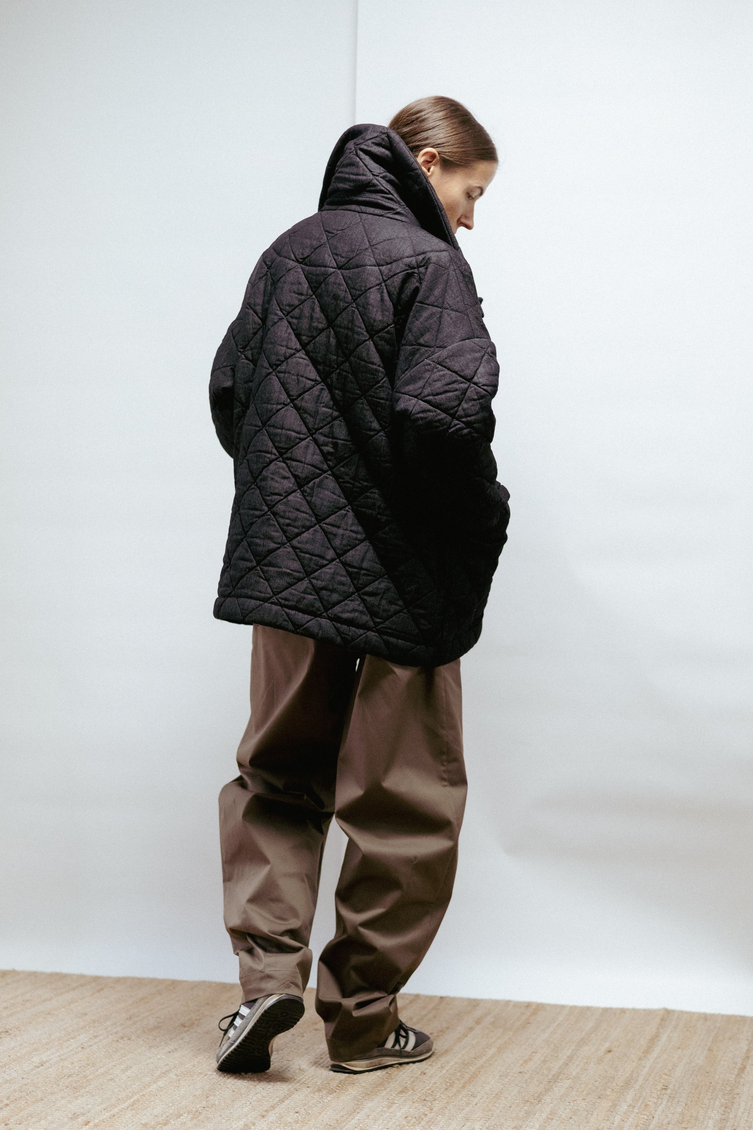 Quilted denim jacket with a straight, relaxed fit. Warmly padded with a high collar and large patch pockets. Made in Estonia.