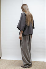Grey jersey blouse.