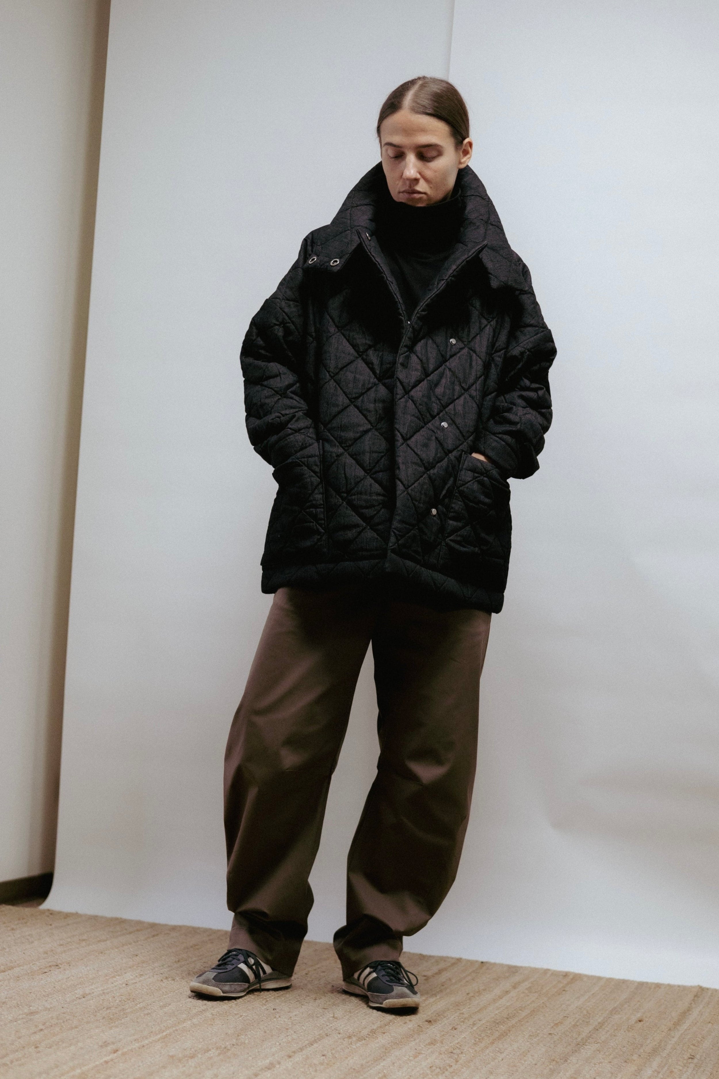 Quilted denim jacket with a straight, relaxed fit. Warmly padded with a high collar and large patch pockets. Made in Estonia.