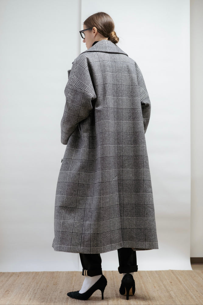 A sculptural wool coat in classic check