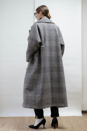 A sculptural wool coat in classic check