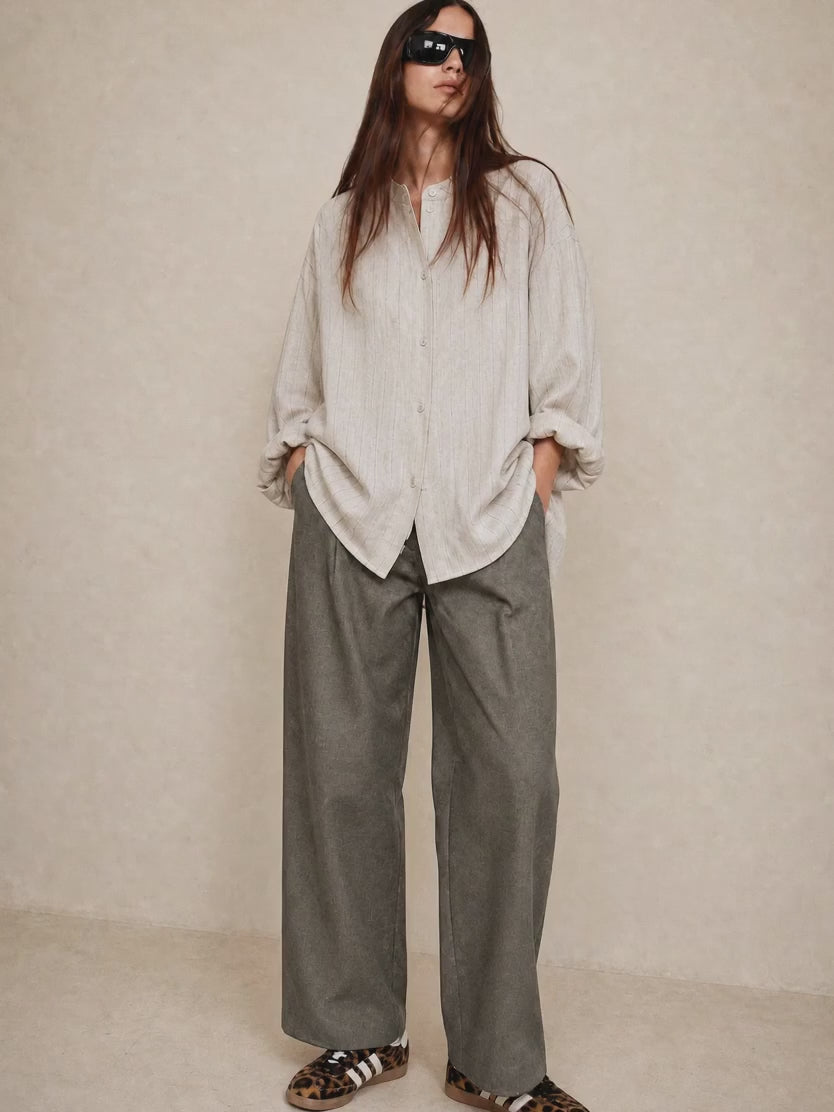 Light blouse and khaki denim trousers