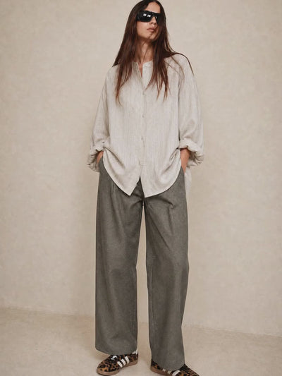 Light blouse and khaki denim trousers